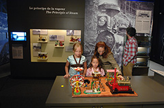 Visitors touring one of the sections of The Ages of Energy Exhibit